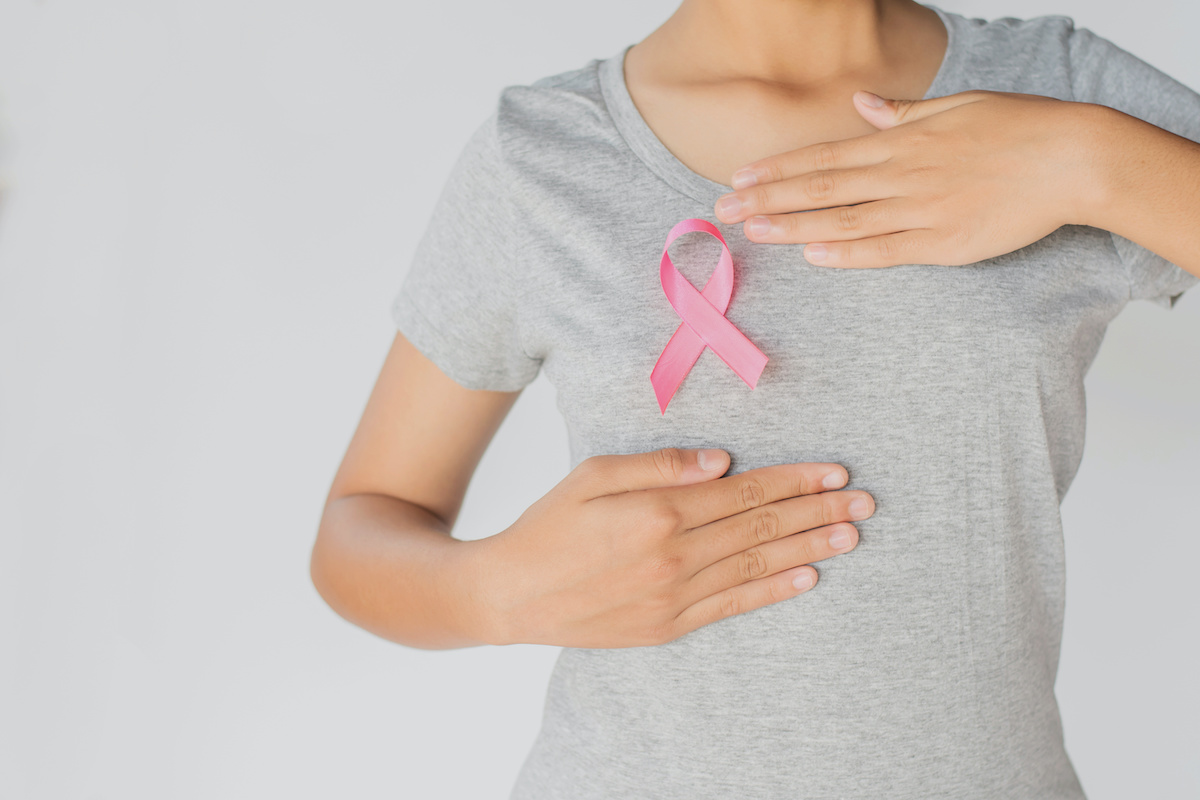 Woman holding pink ribbon breast cancer awareness. concept healthcare and medicine; blog: Types of Breast Exams
