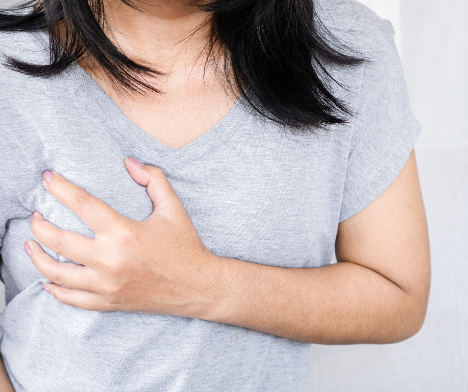 A woman experiencing breast pain and tenderness